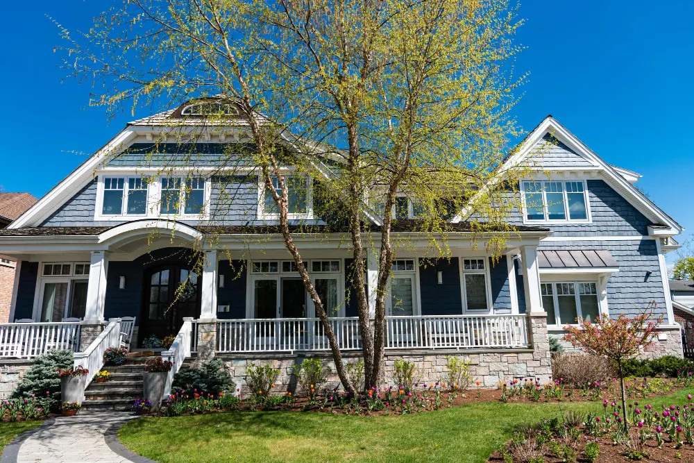 Hamptons-style home with white verandah and timber front door