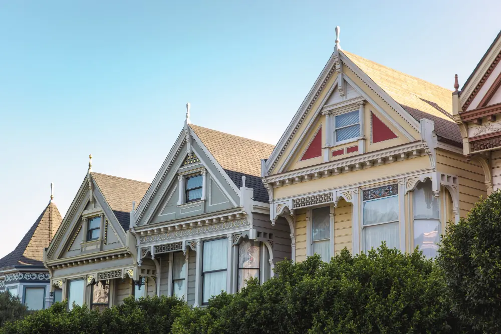Row of Victorian-style homes with decorative gables